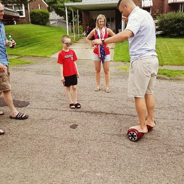 Fun at our Memorial Day family cookout My nephew brought his hover board thing to out family cook out today. Everyone was taking turns, trying not to kill themselves on it. Emmett took a turn as well and had a ton of fun...